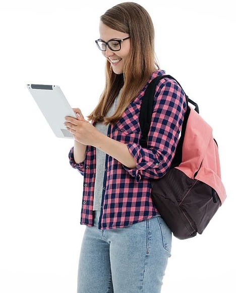 Smiling student with clipboard organizing course material